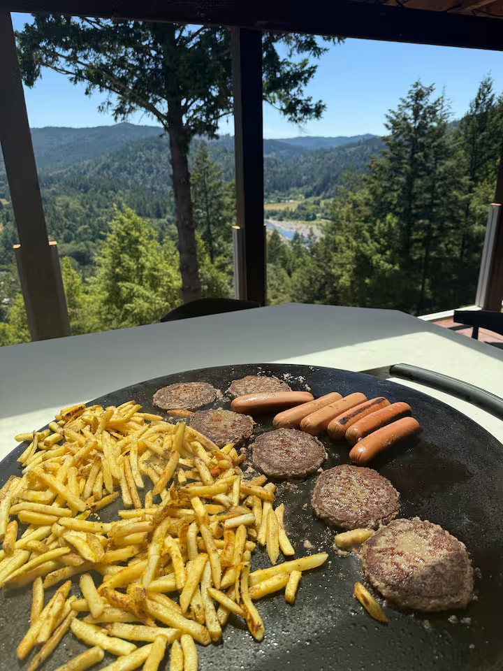 Food cooking on the Cliff House Evo griddle with valley views
