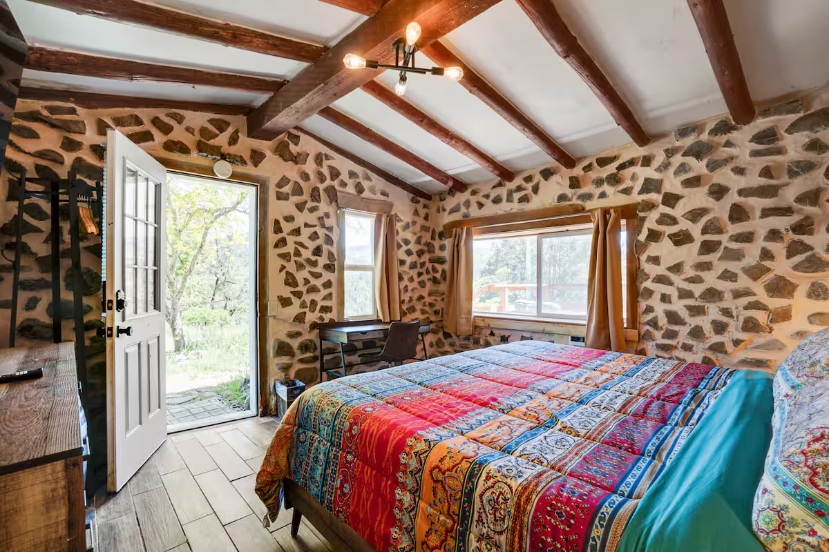 Hobbit House dome ceiling with timber post and exposed beams